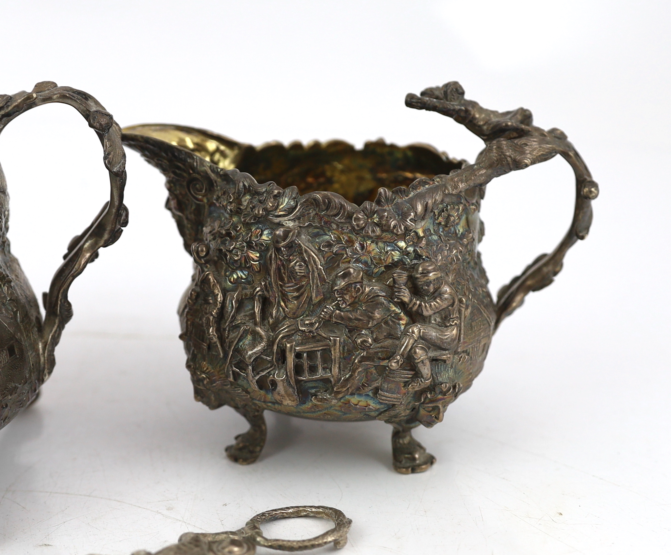 A George IV embossed silver sugar bowl and cream jug by Edward Farrell